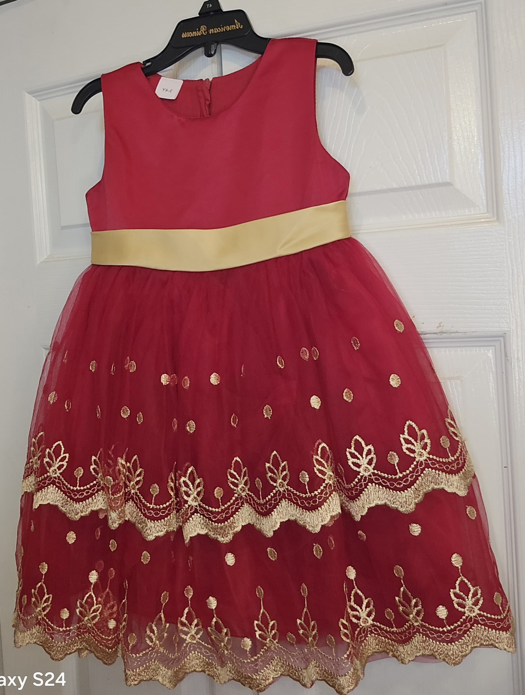Red, golden belt armless children gown